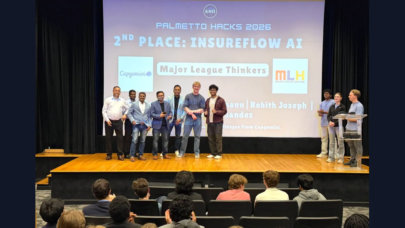 The InsureFlow AI team receiving second place in the Capgemini challenge at PalmettoHacks